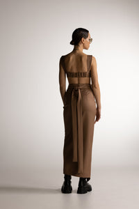 PIXIE WON'T PLAY VENERE WRAP SKIRT CAMEL BROWN VERSATILE WRAP AROUND DESIGN FLATTERING SILHOUETTE EFFORTLESS STYLE TRENDY COMFORTABLE CHIC FEMININE ADJUSTABLE FIT DAY TO NIGHT WEAR CASUAL ELEGANCE SPRING SUMMER FALL WINTER CAPSULE COLLECTION ESSENTIAL LUXURY HIGH WAISTED DOUBLE WRAP